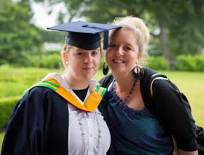 Graduate takes photo with proud mum